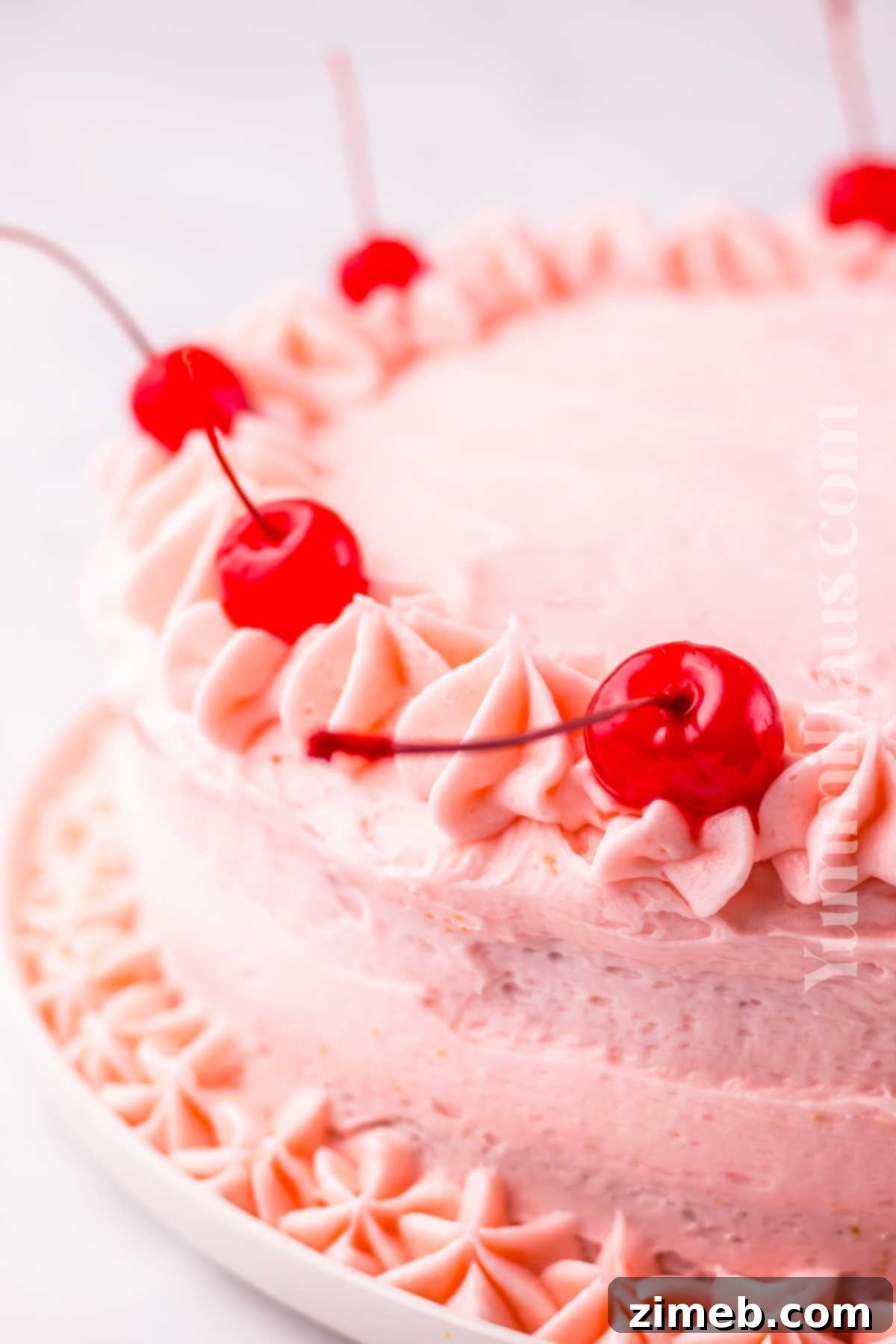 Cherry Confetti Cake 14 Frosted cake with cherry decorations