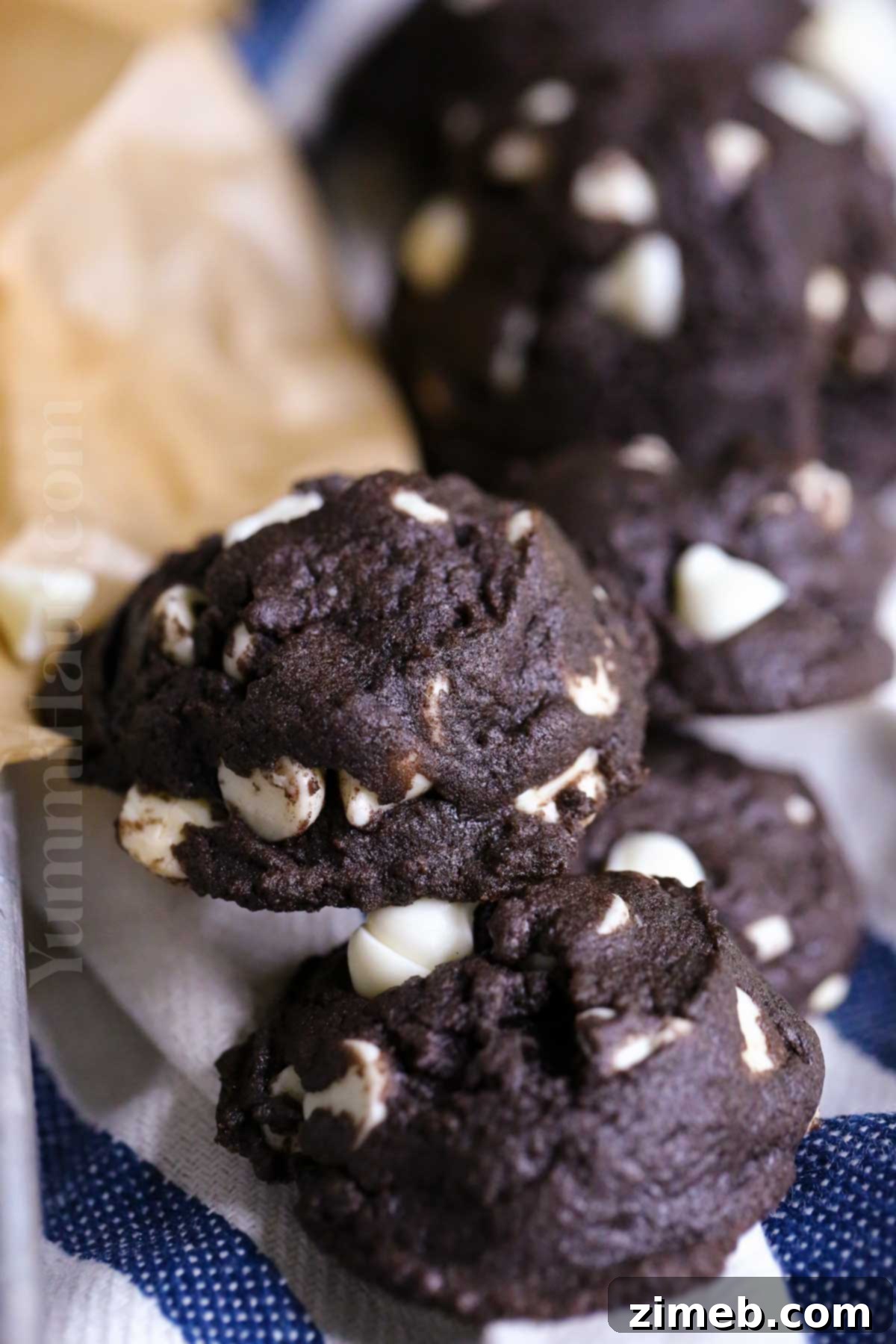 Double Chocolate White Chocolate Cookies 3 Freshly baked White Chocolate Chocolate Cookies cooling on a rack.