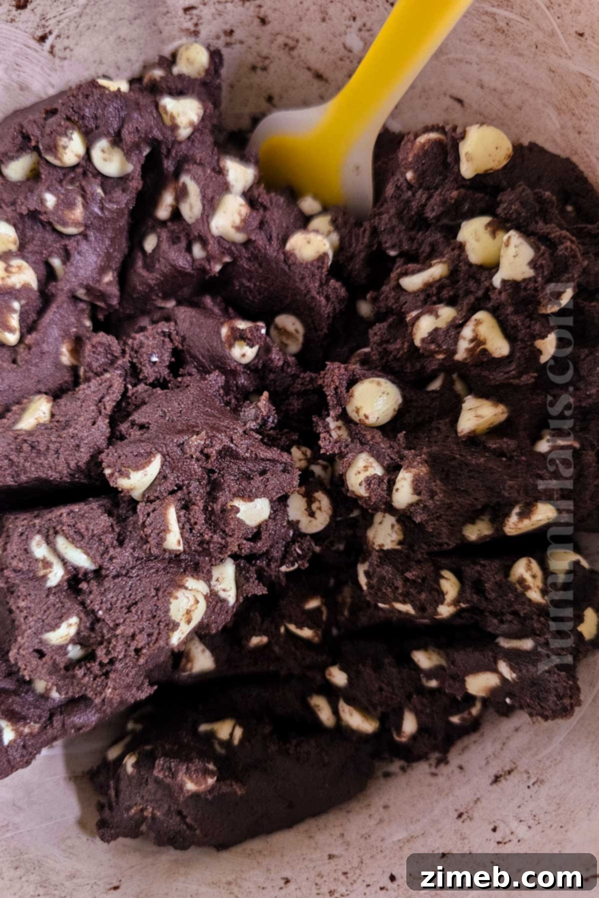 Double Chocolate White Chocolate Cookies 6 Unbaked chocolate cookie dough with white chocolate chips.