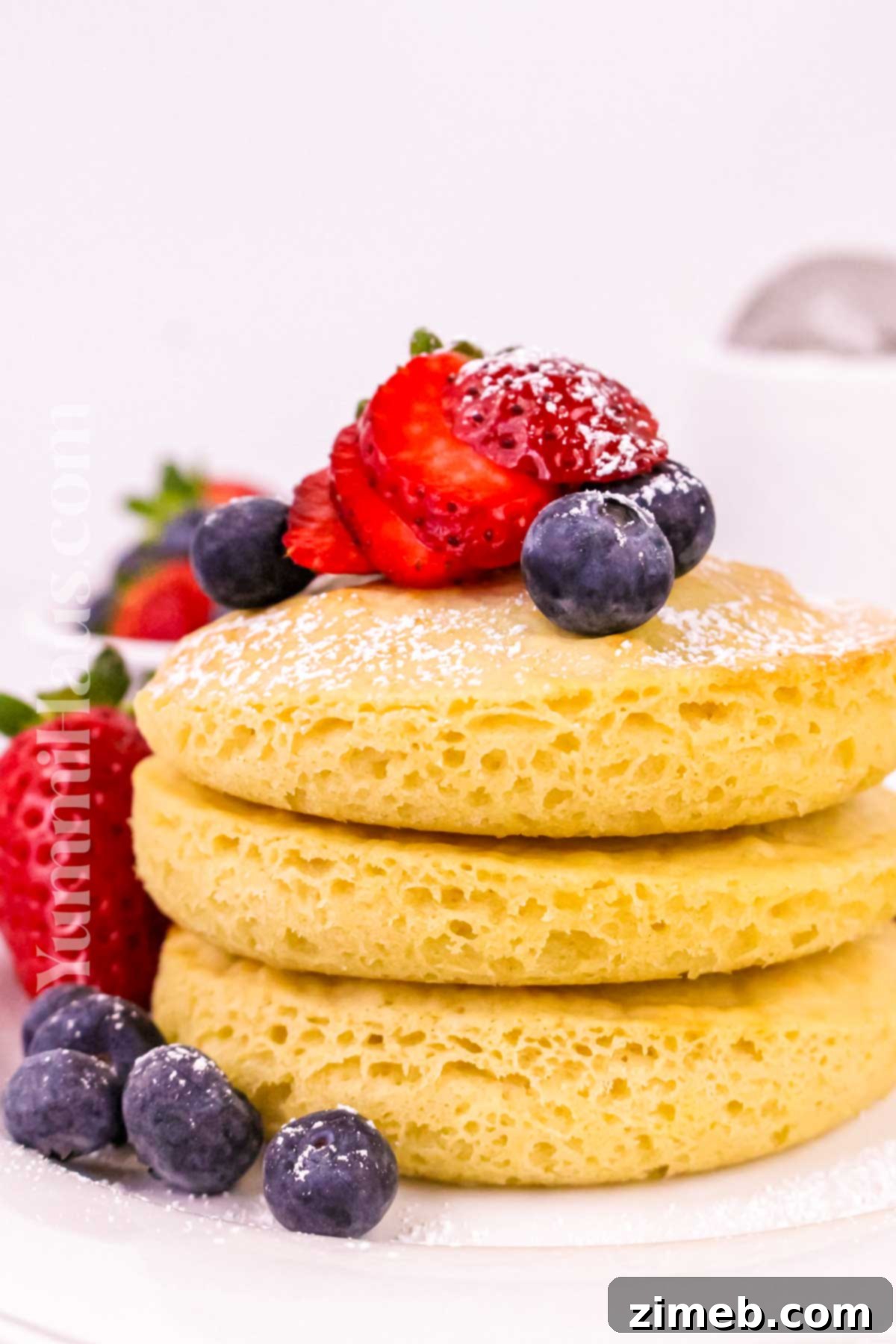 Fluffy Air Fryer Pancakes 8 Finished fluffy pancake recipe, topped with fruit and syrup
