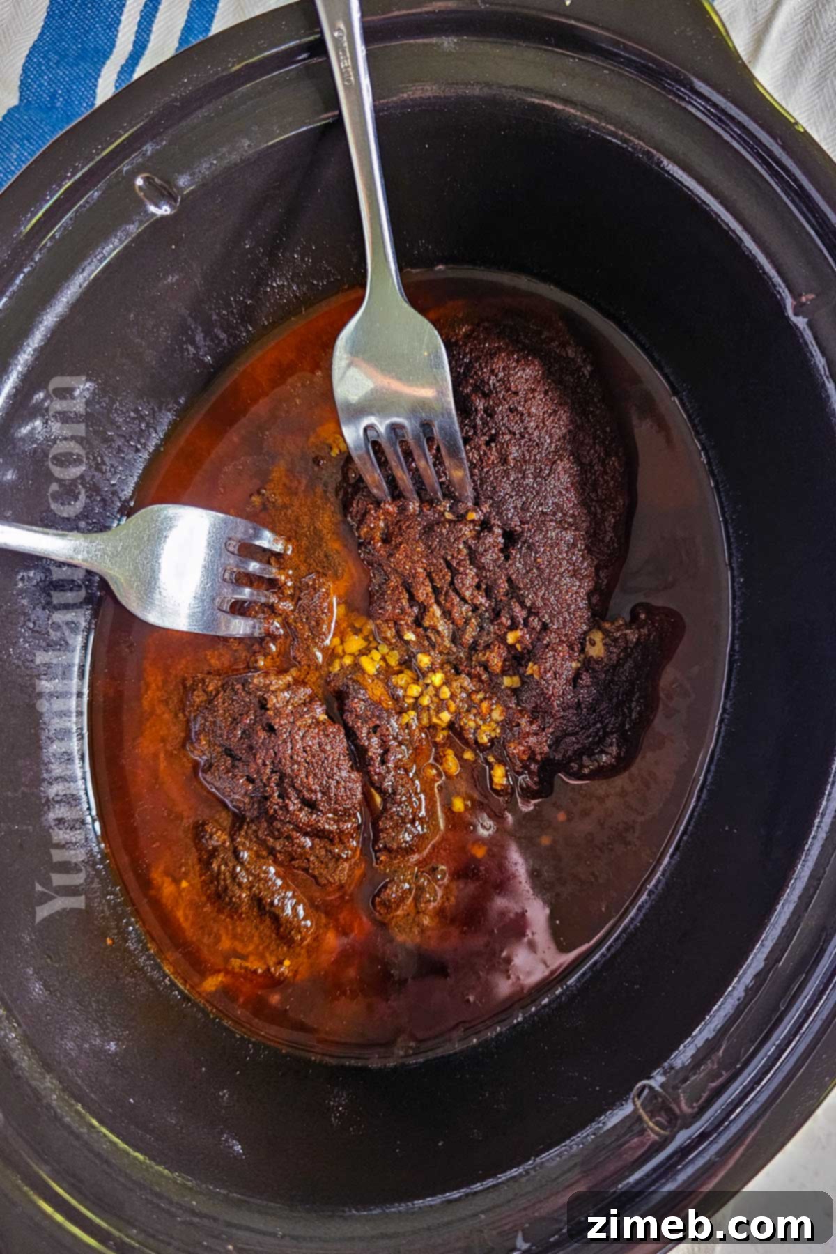 Melt-in-Your-Mouth Shredded Beef 6 Slow Cooker Shredded Beef being served