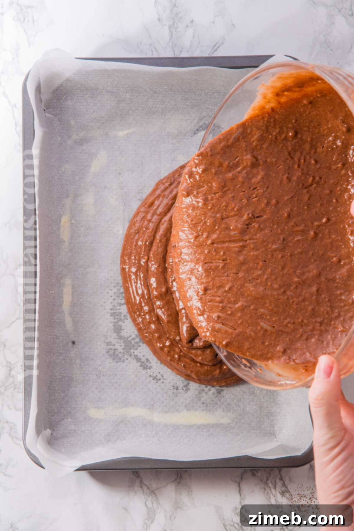 Rich Guinness Chocolate Stout Cake 7 Baked Chocolate Guinness Cake cooling on a wire rack, ready for frosting.