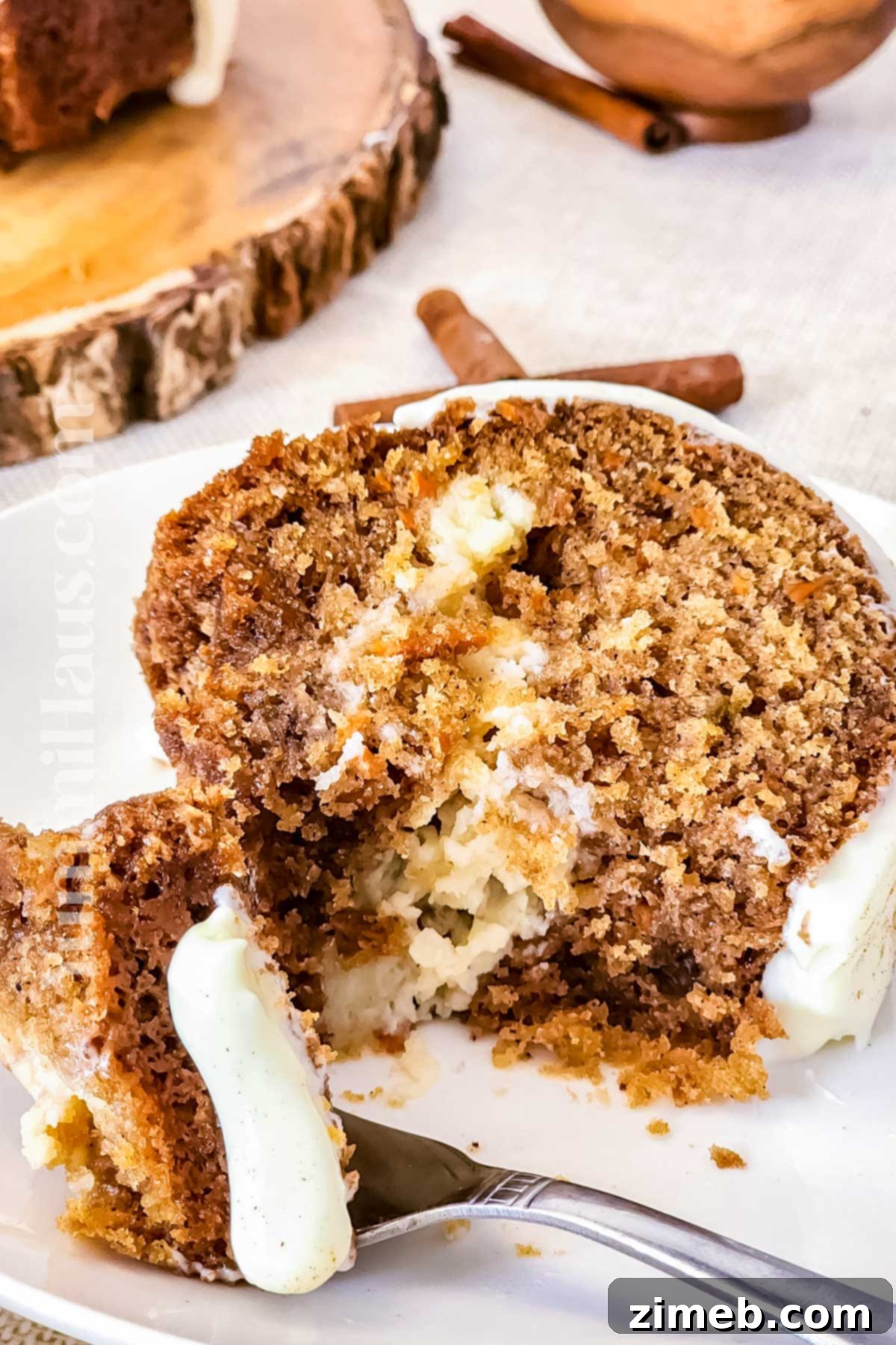 Carrot Bundt Cake with cream cheese filling and glaze, perfect for any occasion.