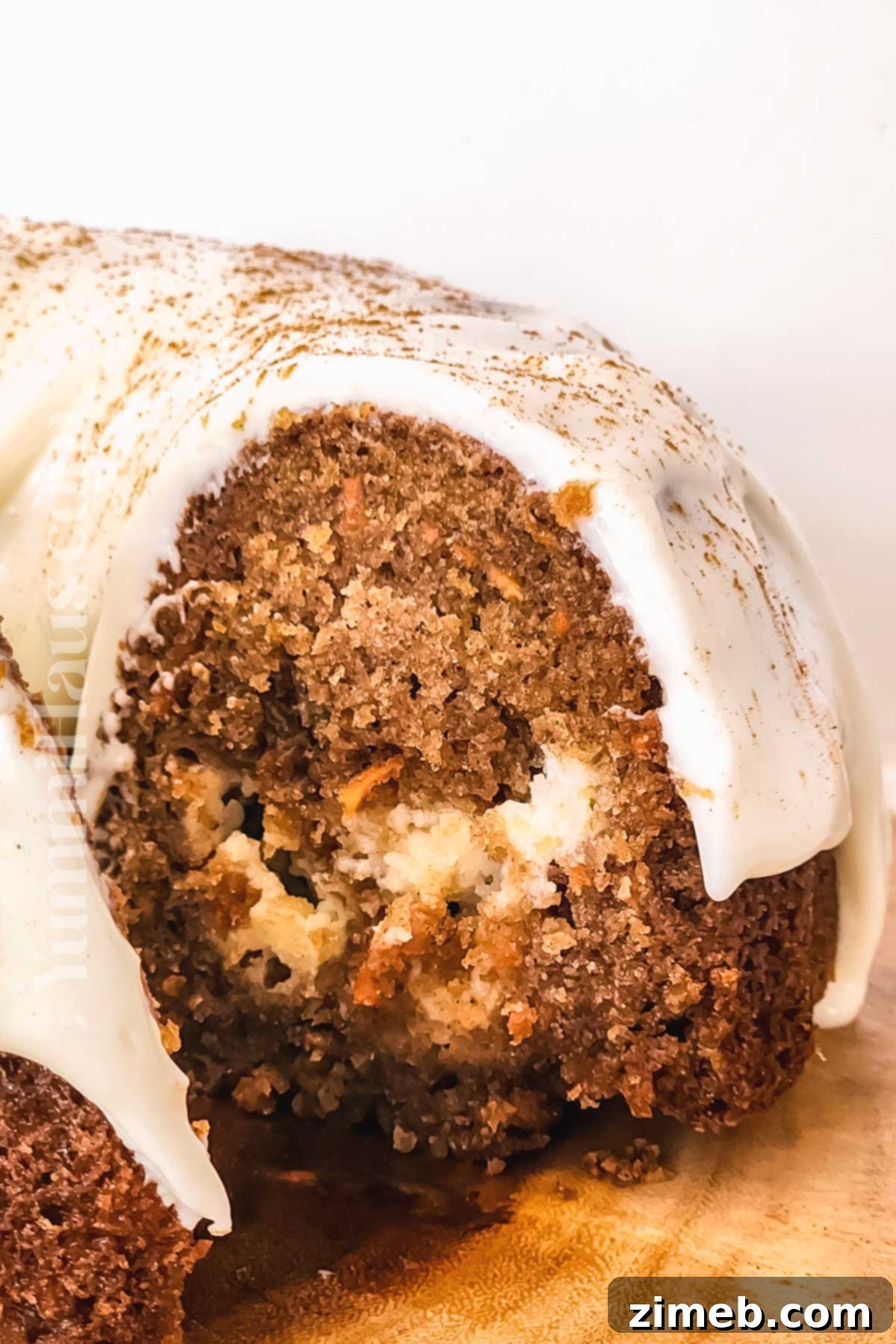 A slice of Carrot Bundt Cake, revealing the luscious cream cheese filling within.