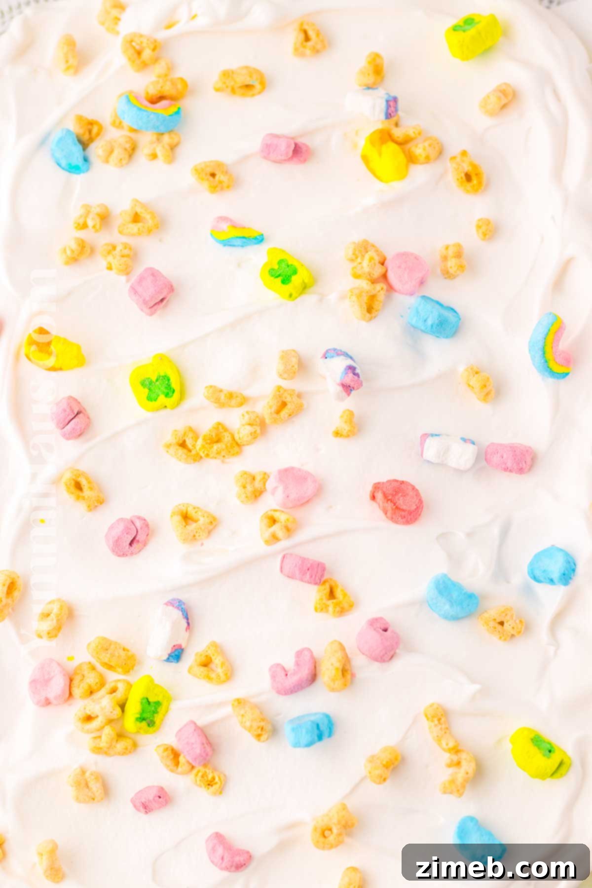 Rainbow Charm Elixir 8 Seven distinct steps for how to make Lucky Charms Lush, showcasing the layering process in a baking dish