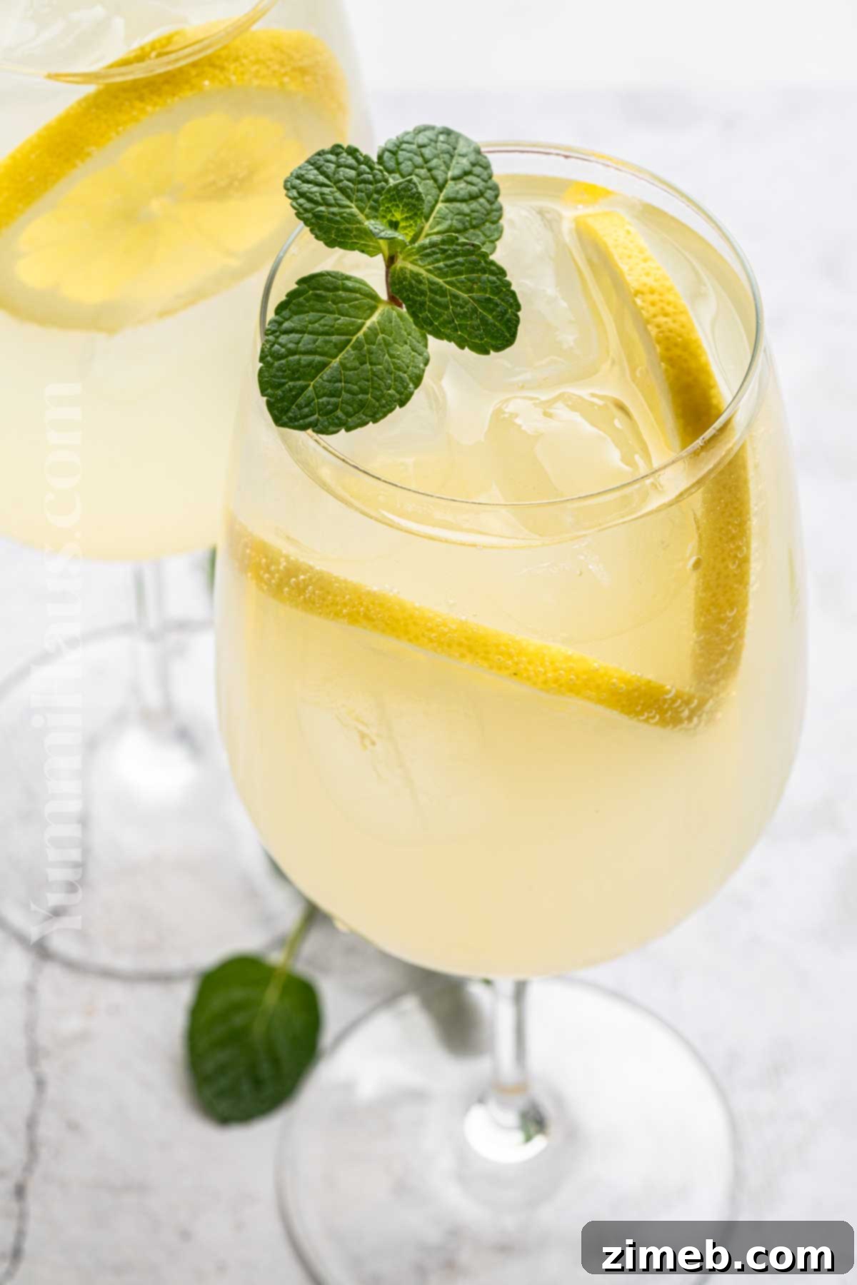 Refreshing Limoncello Spritz 3 Celebratory lemon drink in a tall glass, sparkling beautifully in the light