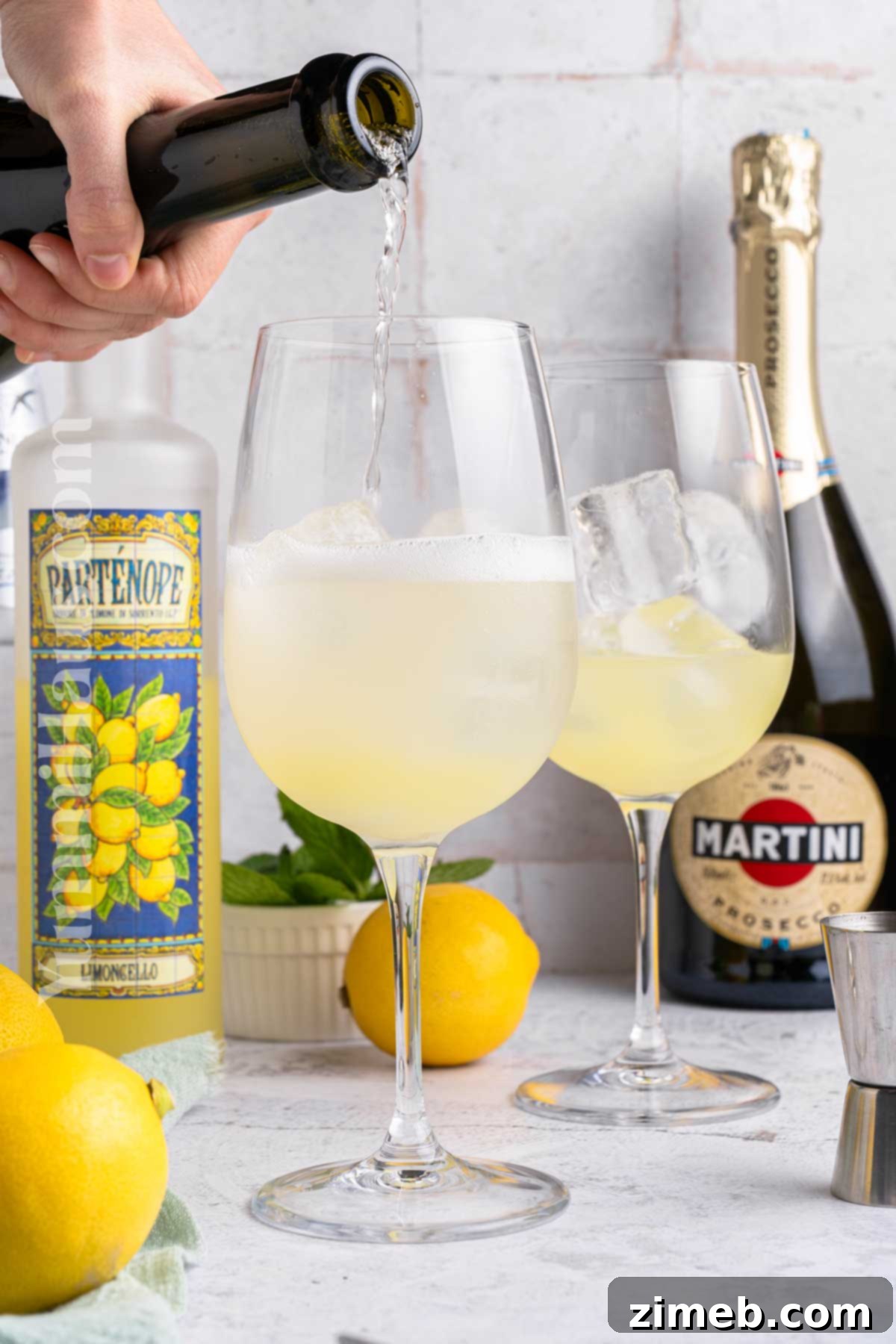 Refreshing Limoncello Spritz 6 Close-up of a perfectly made Limoncello Spritz in a glass with lemon and mint garnish