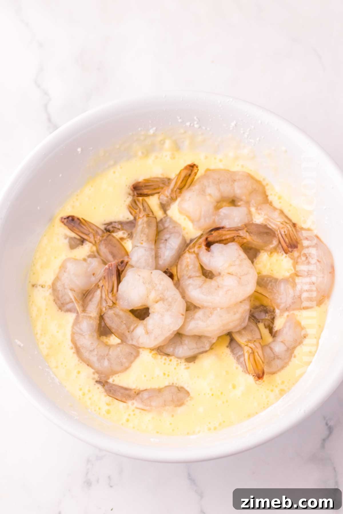 Golden Honey Walnut Shrimp 6 Honey Walnut Shrimp being coated in its sweet, creamy sauce.