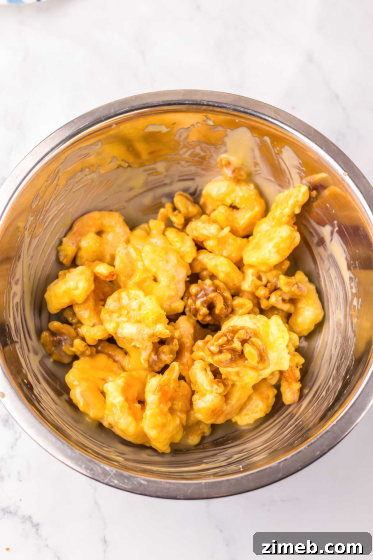 Golden Honey Walnut Shrimp 8 Finished Honey Walnut Shrimp dish, garnished with scallions and ready to serve.