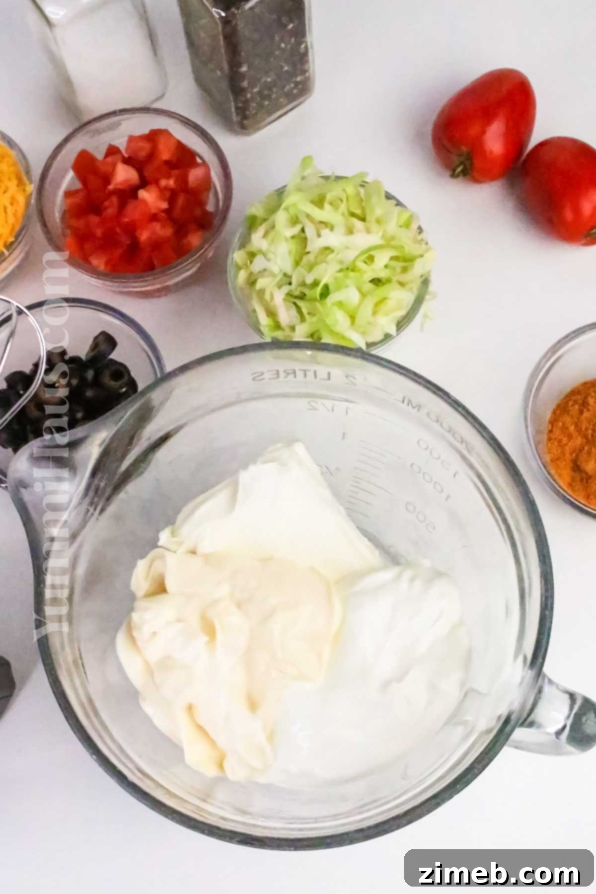 Fiesta Taco Dip 5 Making the creamy layers for taco dip