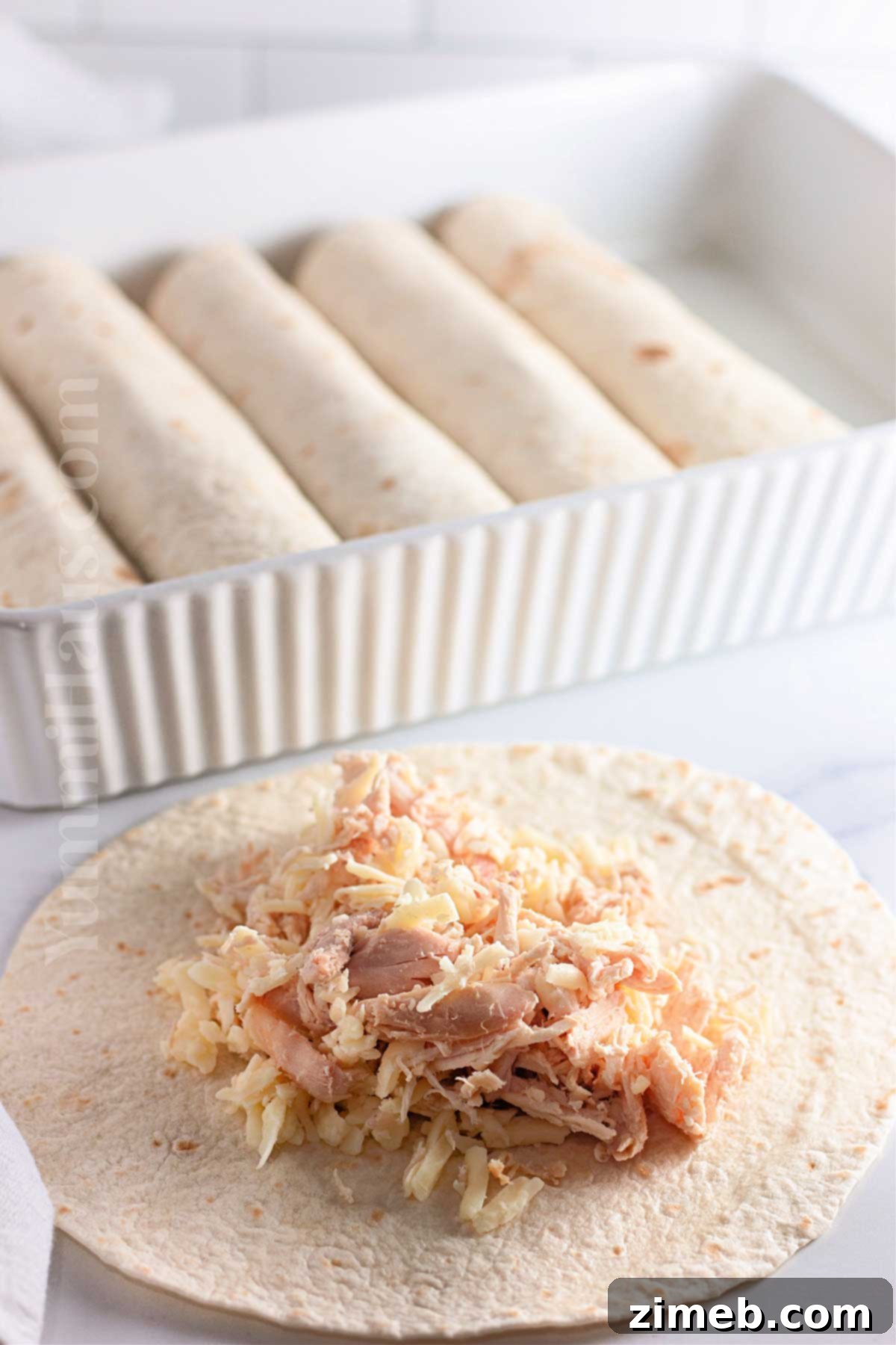 Creamy White Chicken Enchiladas 6 how to make White Chicken Enchiladas