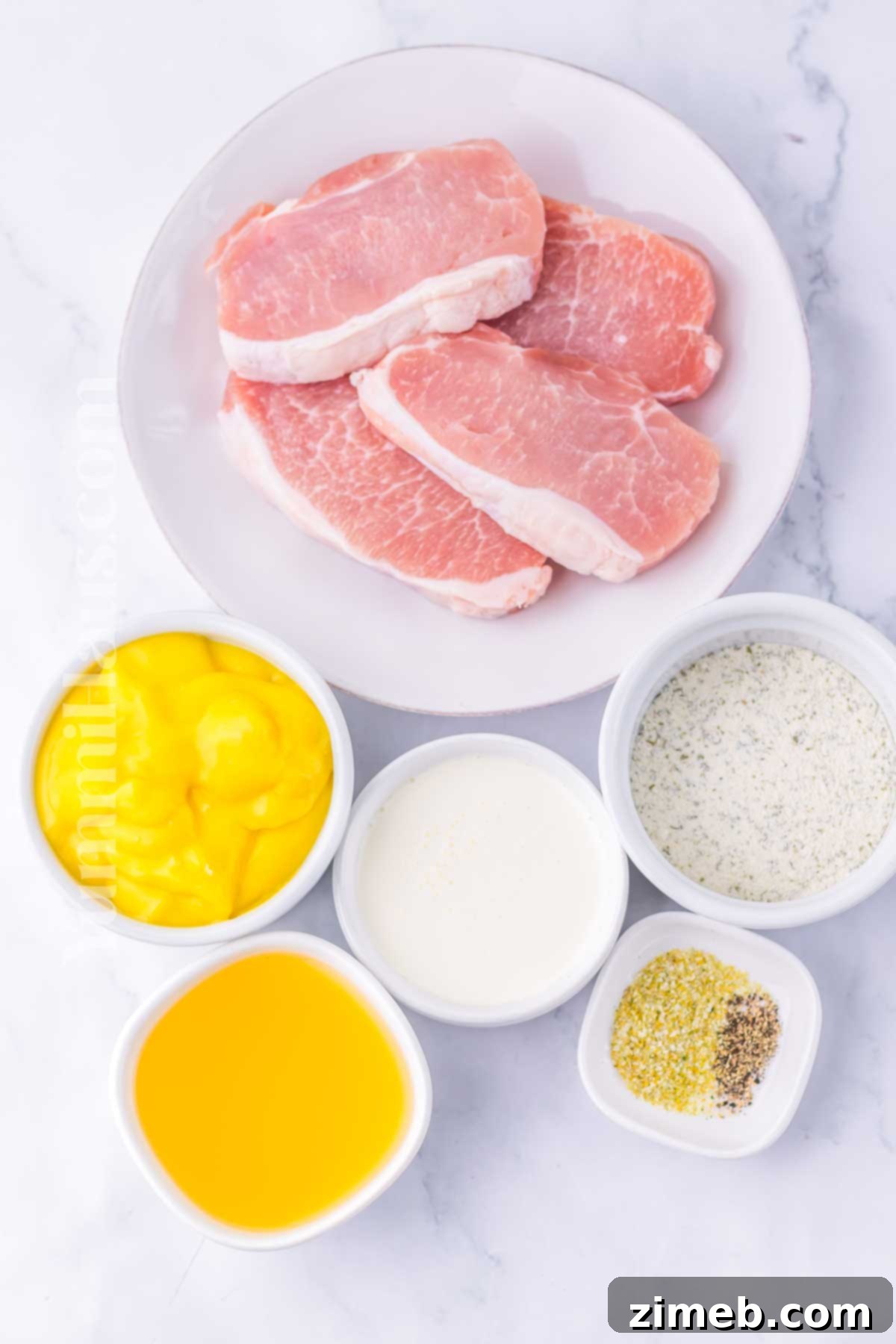 Ingredients for Slow Cooker Ranch Pork Chops, including pork, cream of chicken soup, heavy cream, chicken broth, and ranch seasoning.