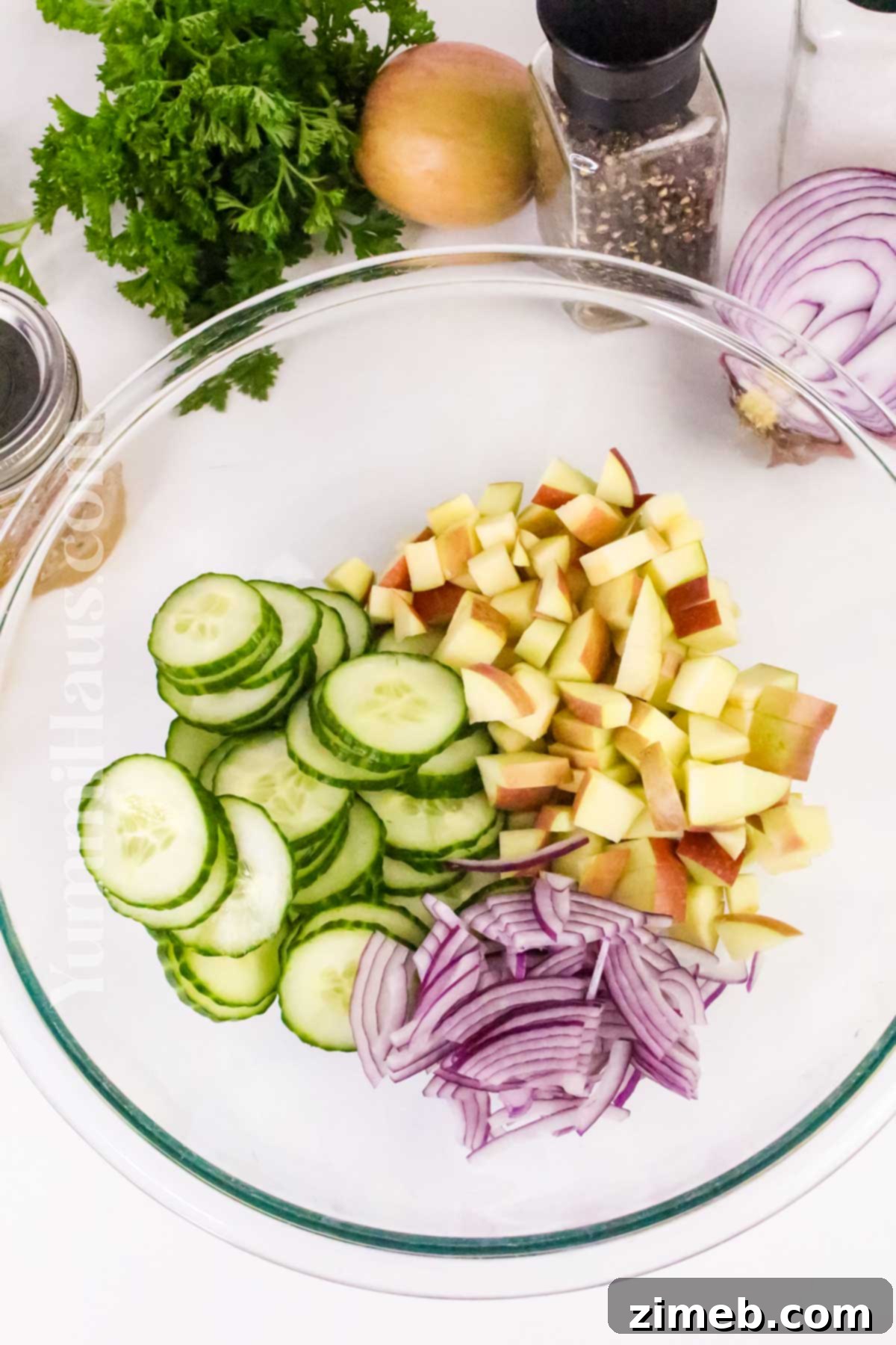 Tossing a refreshing side salad recipe with fresh ingredients.