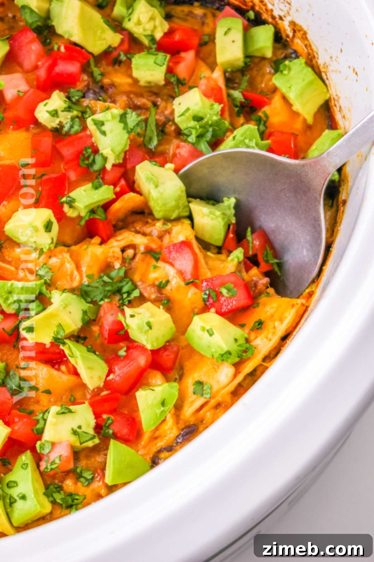 Easy Slow Cooker Mexican Casserole 8 Large slow cooker filled with Crockpot Mexican Casserole, ready to be served.