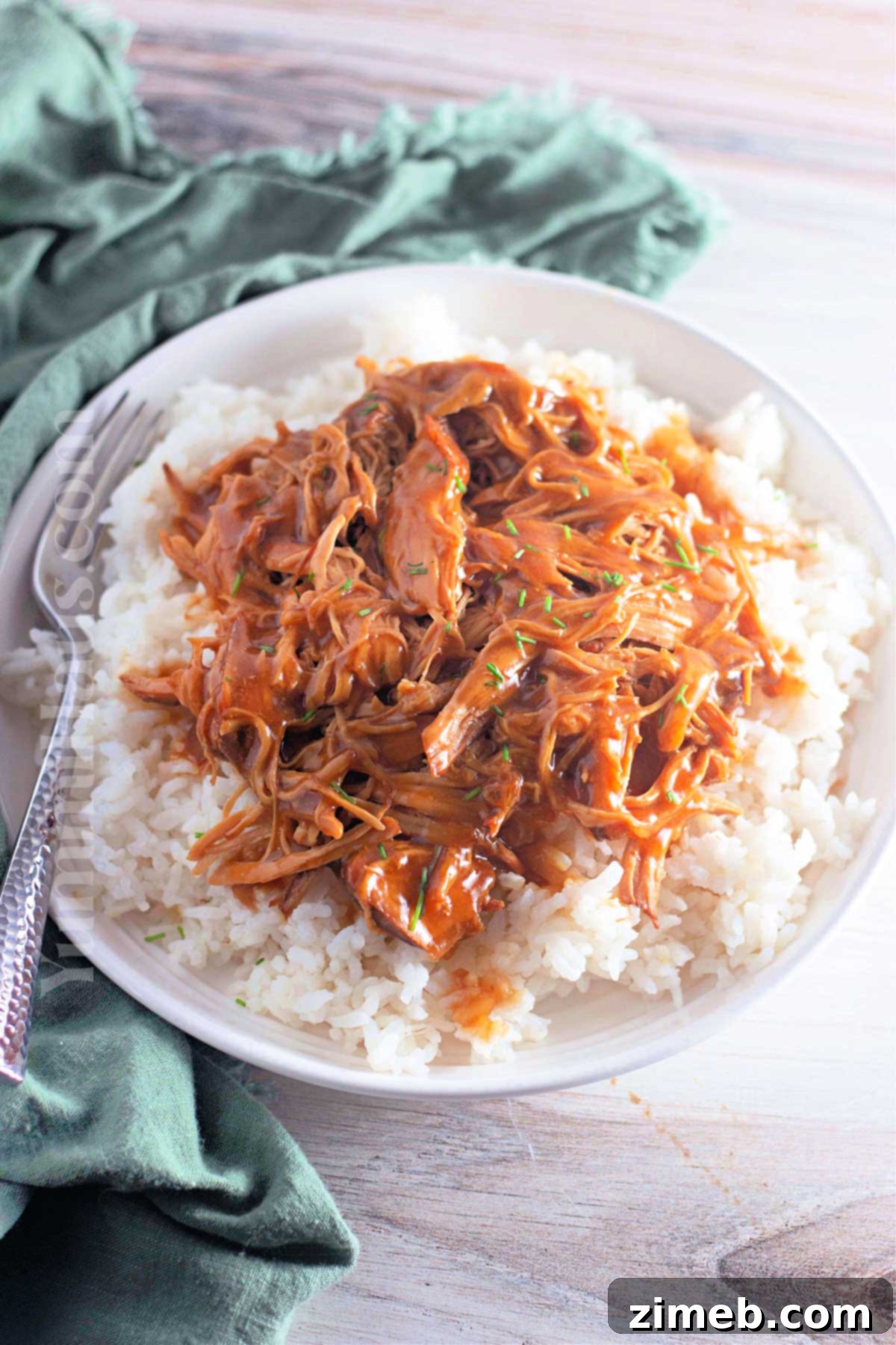 Caramelized Honey Garlic Chicken 14 Slow Cooker Garlic Honey Chicken recipe ready to be enjoyed with rice and green onions.