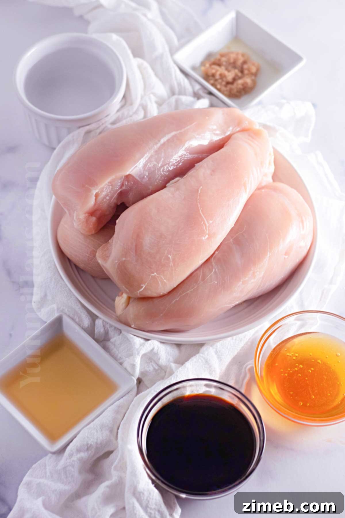 Caramelized Honey Garlic Chicken 4 Key ingredients for Slow Cooker Garlic Honey Chicken: boneless skinless chicken breasts, honey, soy sauce, water, and minced garlic.