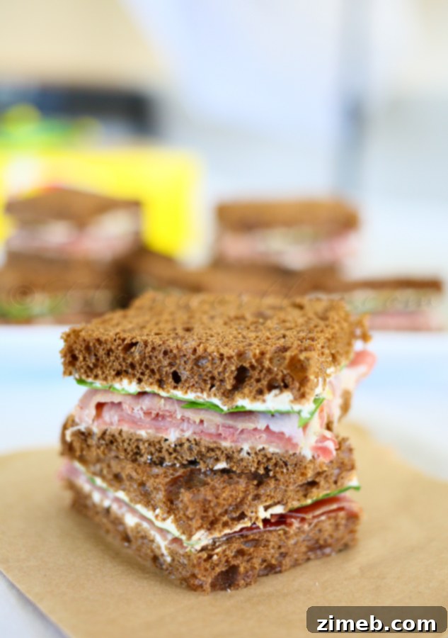 Delicate Prosciutto French Onion Tea Sandwiches, filled with caramelized onions and salty prosciutto, perfect for a tea party or picnic.