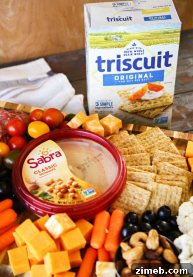 An inviting Easy Charcuterie Board, featuring an artful assortment of cheeses, meats, crackers, and fruits, perfect for entertaining.