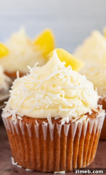 Fluffy Pina Colada Cupcakes with coconut and pineapple, perfect for celebrations.