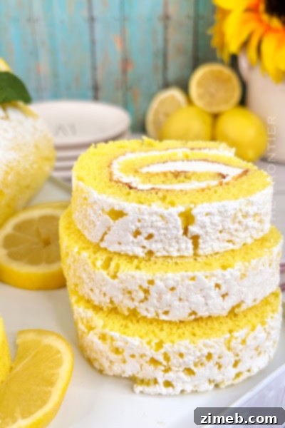 Tangy and sweet Lemon Roll Cake with creamy cream cheese filling.