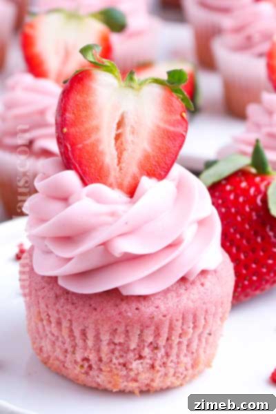 Homemade Strawberry Cupcakes with creamy frosting, bursting with fresh flavor.