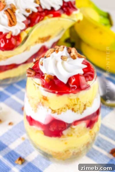 Classic Punch Bowl Cake with fruit and whipped topping, perfect for Mother's Day brunch.