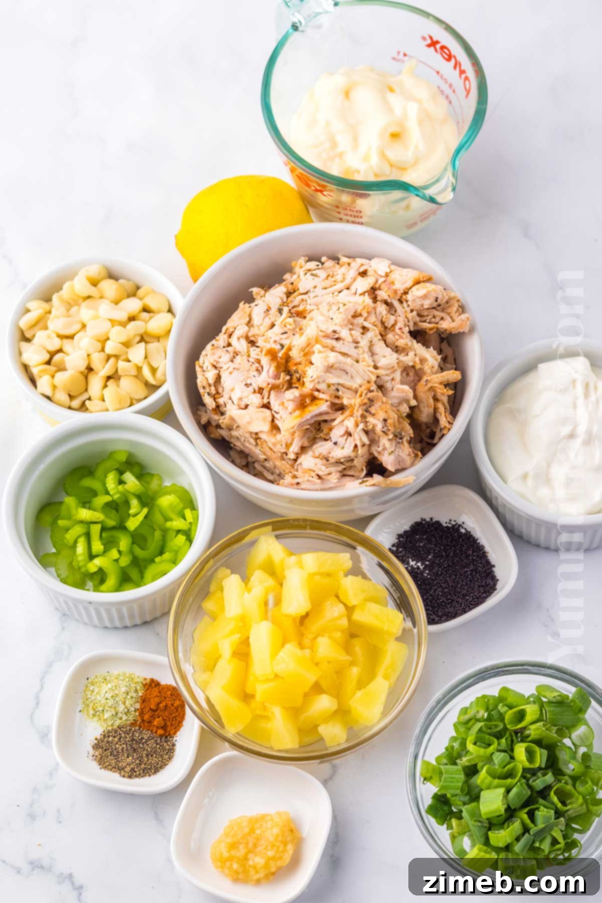 Luau Chicken Salad 4 Ingredients for Hawaiian Chicken Salad arranged on a wooden board.