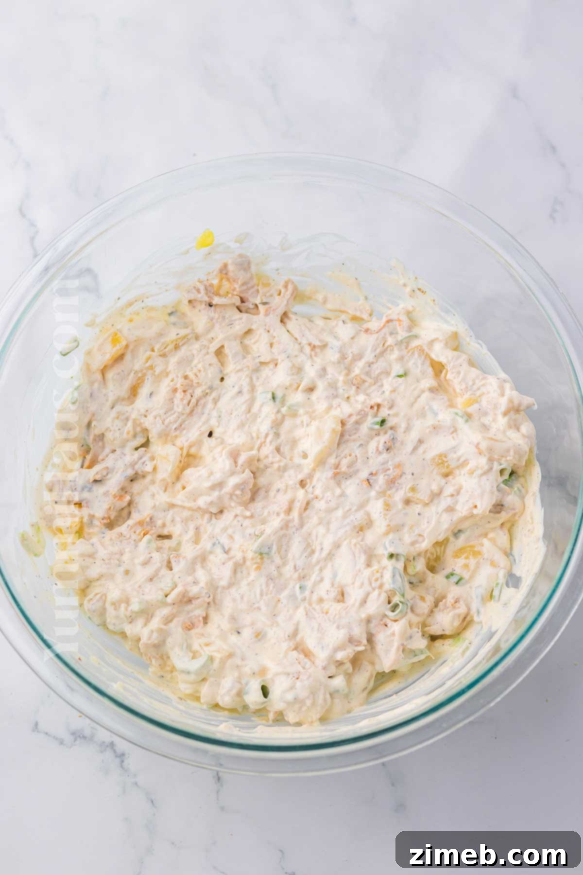 Luau Chicken Salad 6 Mixing the chicken and pineapple for Hawaiian Chicken Salad