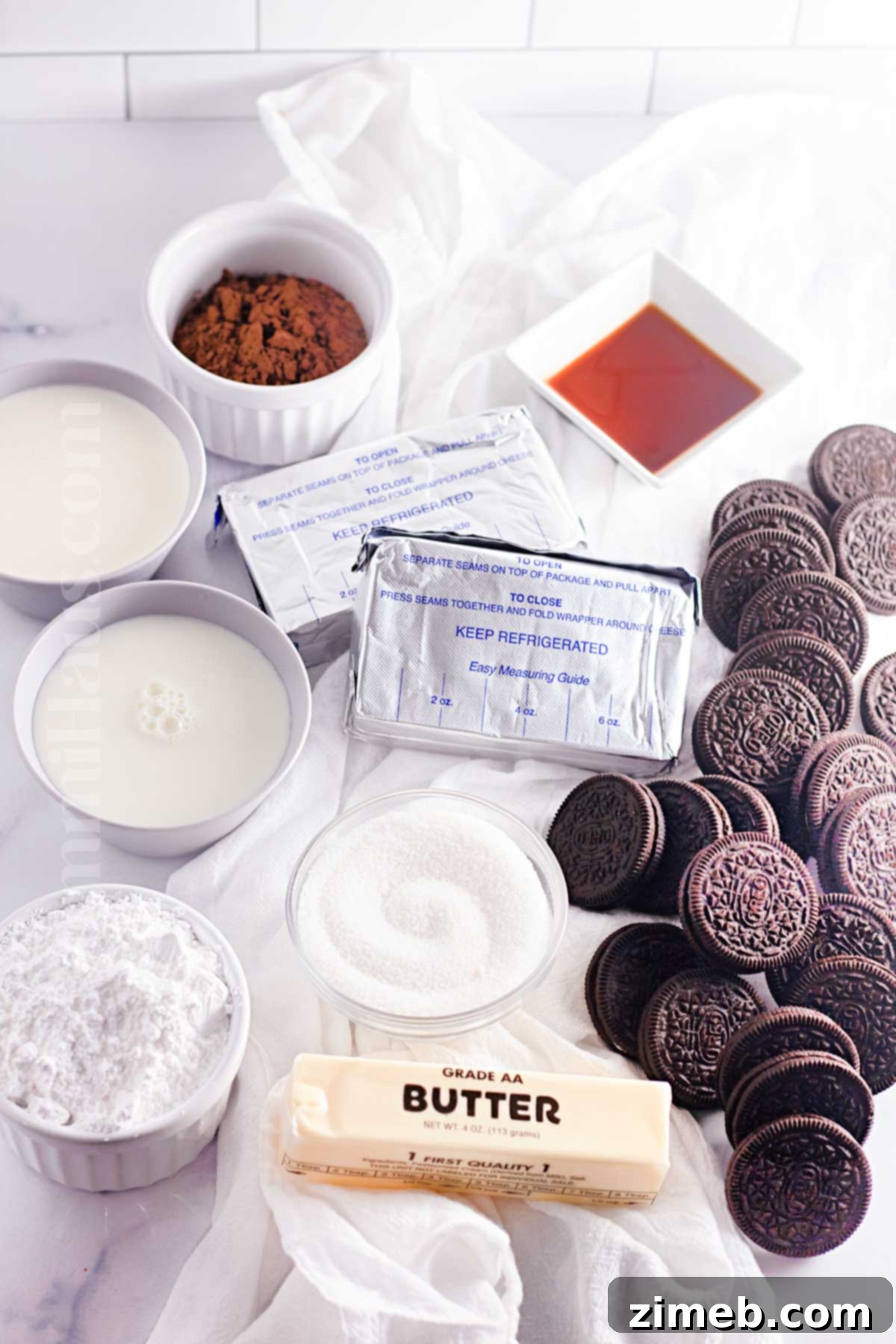Various ingredients for No-Bake Oreo Pie laid out on a counter