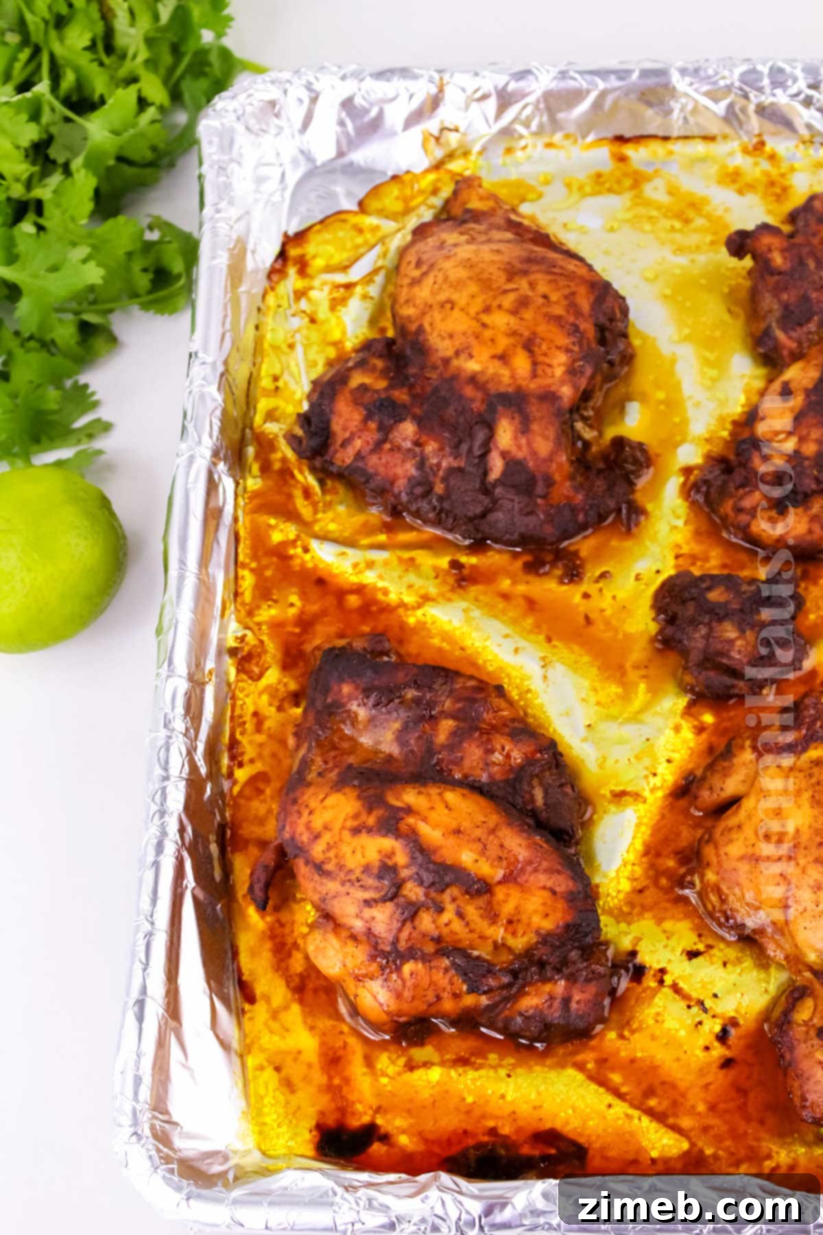 Classic Tandoori Chicken Masala 7 baked chicken on a sheet pan