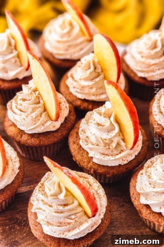 Celebrate with Cupcakes: Endless Flavors for Every Occasion 5 Homemade Apple Cider Cupcakes with apple cider buttercream, vanilla, and caramel topping, ideal for fall holidays.
