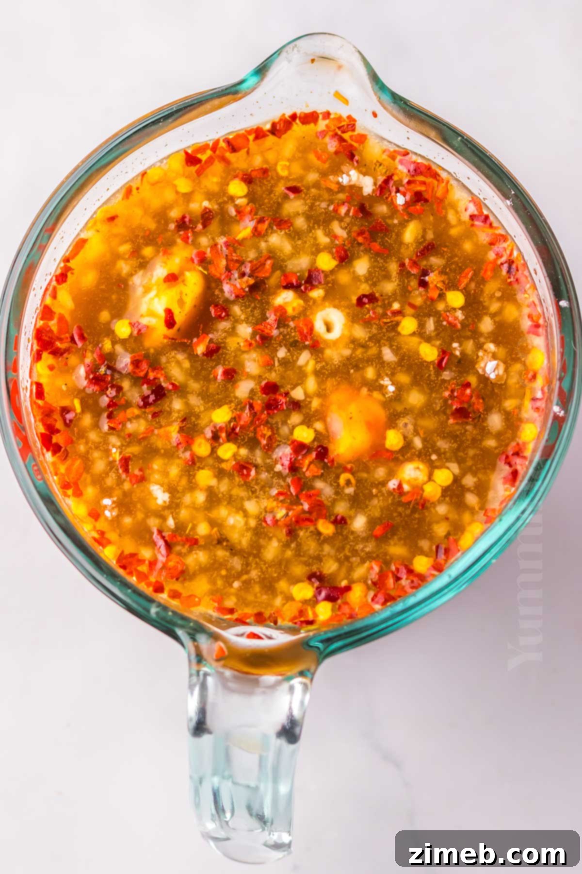 Mixing the sauce for slow cooker chicken wings