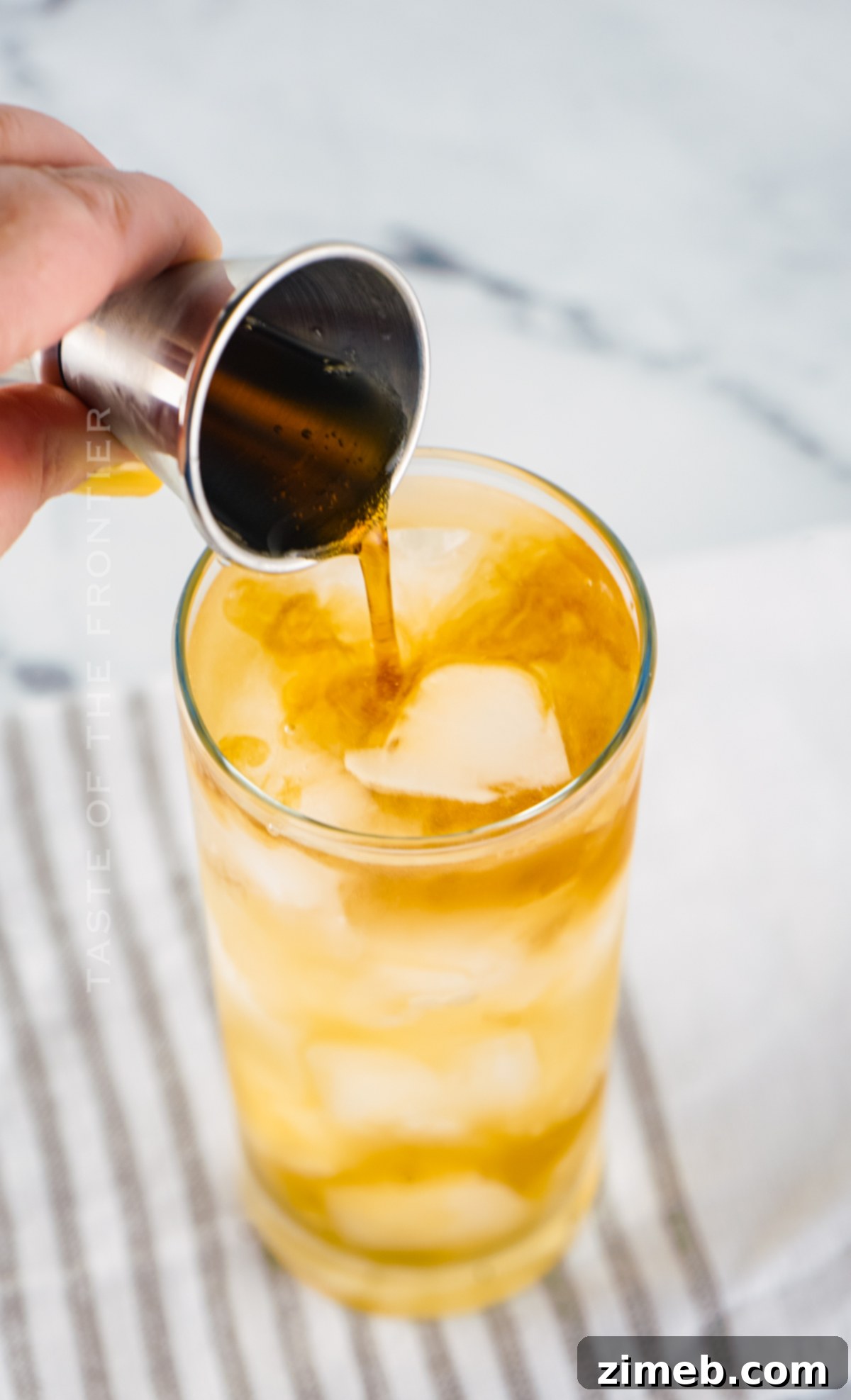 adding the coke to a Long Island Iced Tea