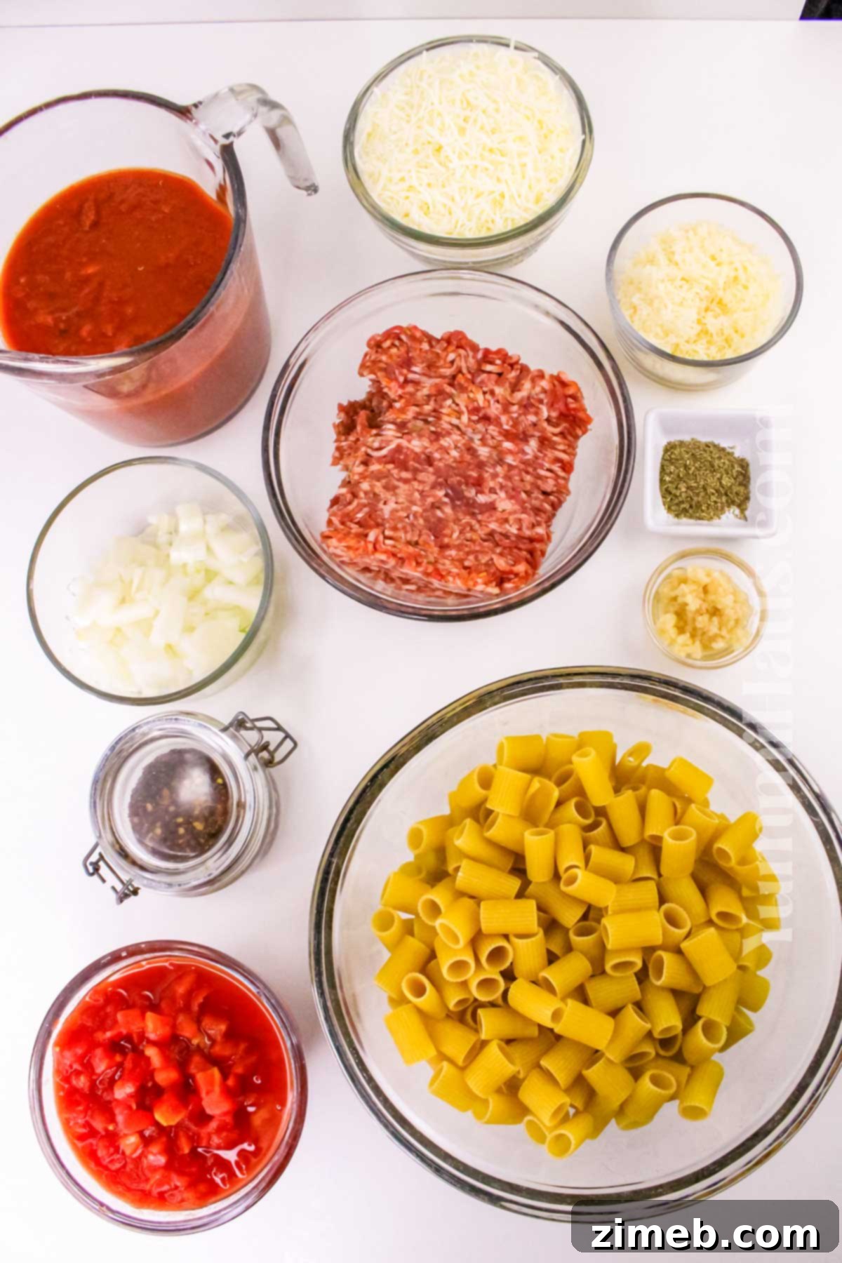 Ingredients for Baked Rigatoni with Sausage laid out on a table
