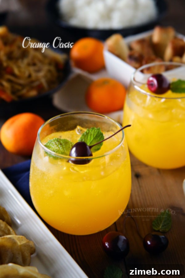 An Orange Oasis Chinese Cocktail in a decorative glass, showing its bright orange hue, garnished with a cherry and orange slice.