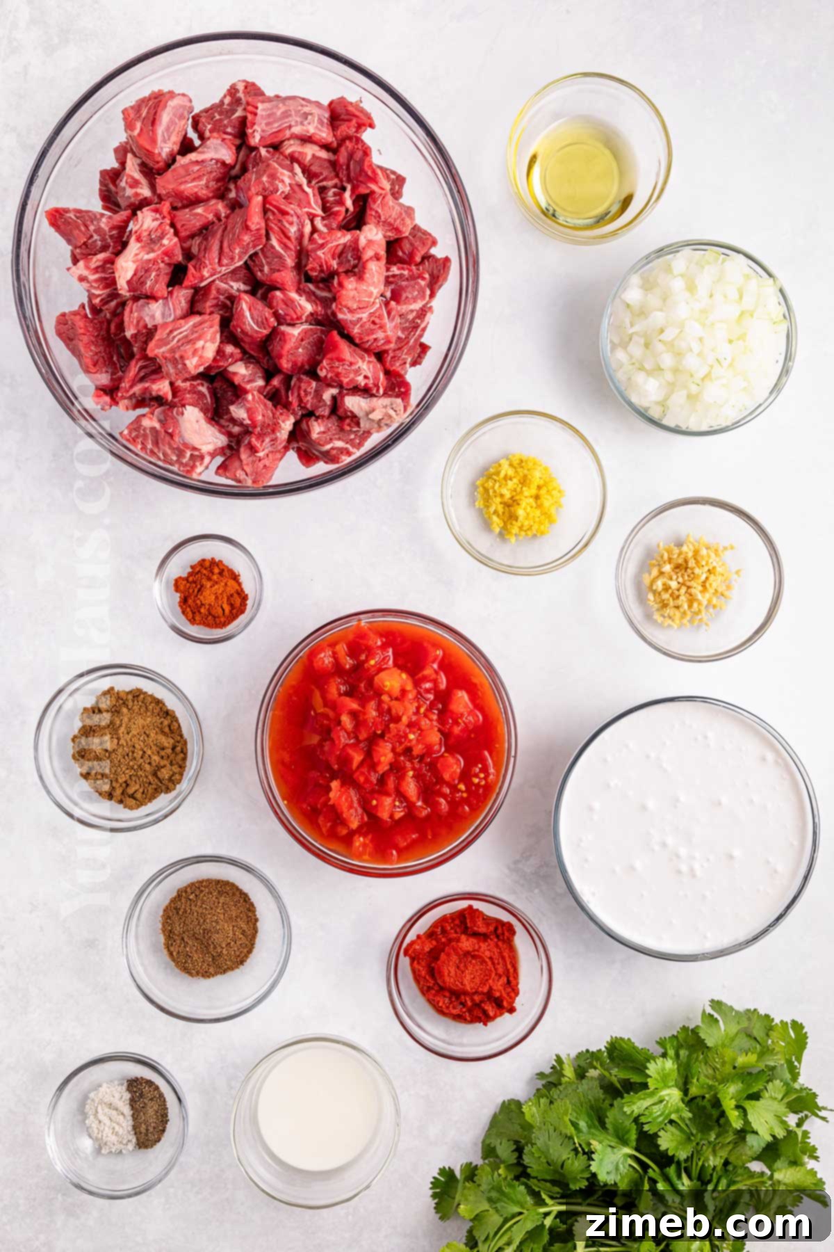 Fall-Apart Tender Slow Cooker Beef Curry 3 Ingredients for Slow Cooker Curry Beef, including beef, coconut milk, curry paste, and fresh aromatics.
