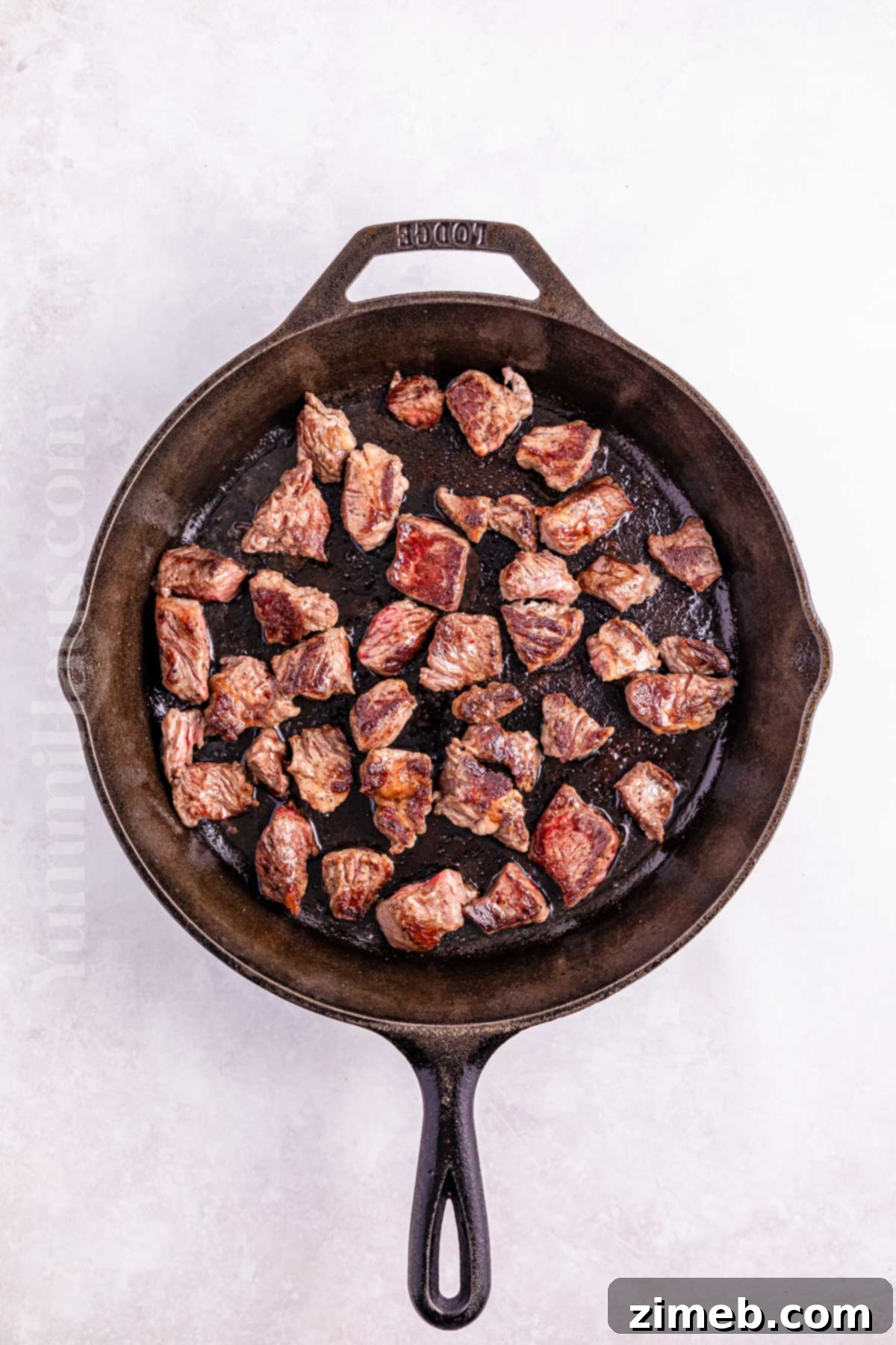 Fall-Apart Tender Slow Cooker Beef Curry 4 Browning beef chunks in a skillet before slow cooking for enhanced flavor.