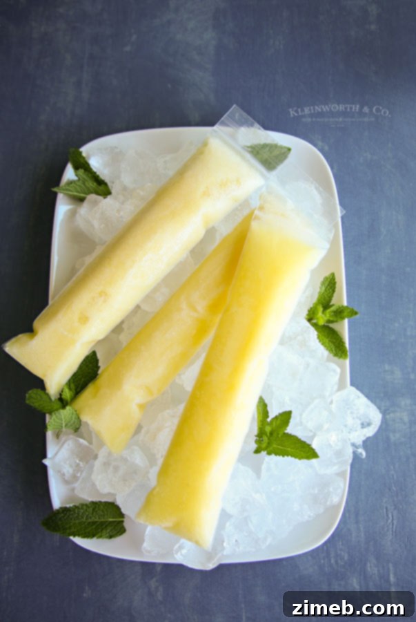 35 Refreshing Summer Frozen Treats 35 Dole Whip Pops recipe - Dirty Pineapple Whip Pops, tropical pops with pineapple, coconut, and a splash of rum.