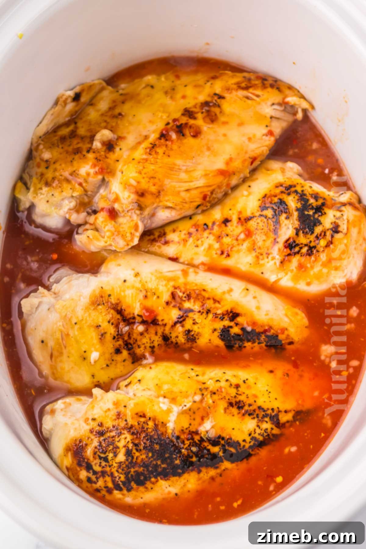 Sweet and Tart Slow Cooker Chicken 6 Steps on how to make Slow Cooker Lemonade Chicken, from searing to slow cooking.