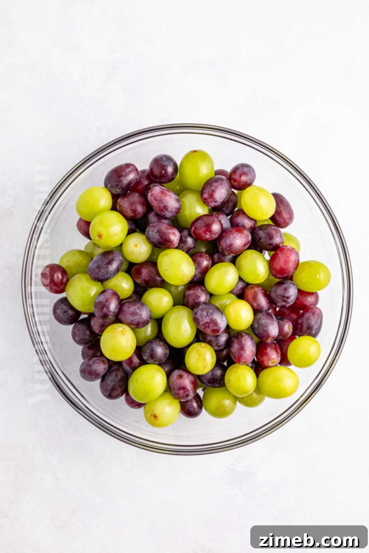 Creamy Grape Salad Delight 4 Preparing fresh grapes for a creamy grape salad recipe.
