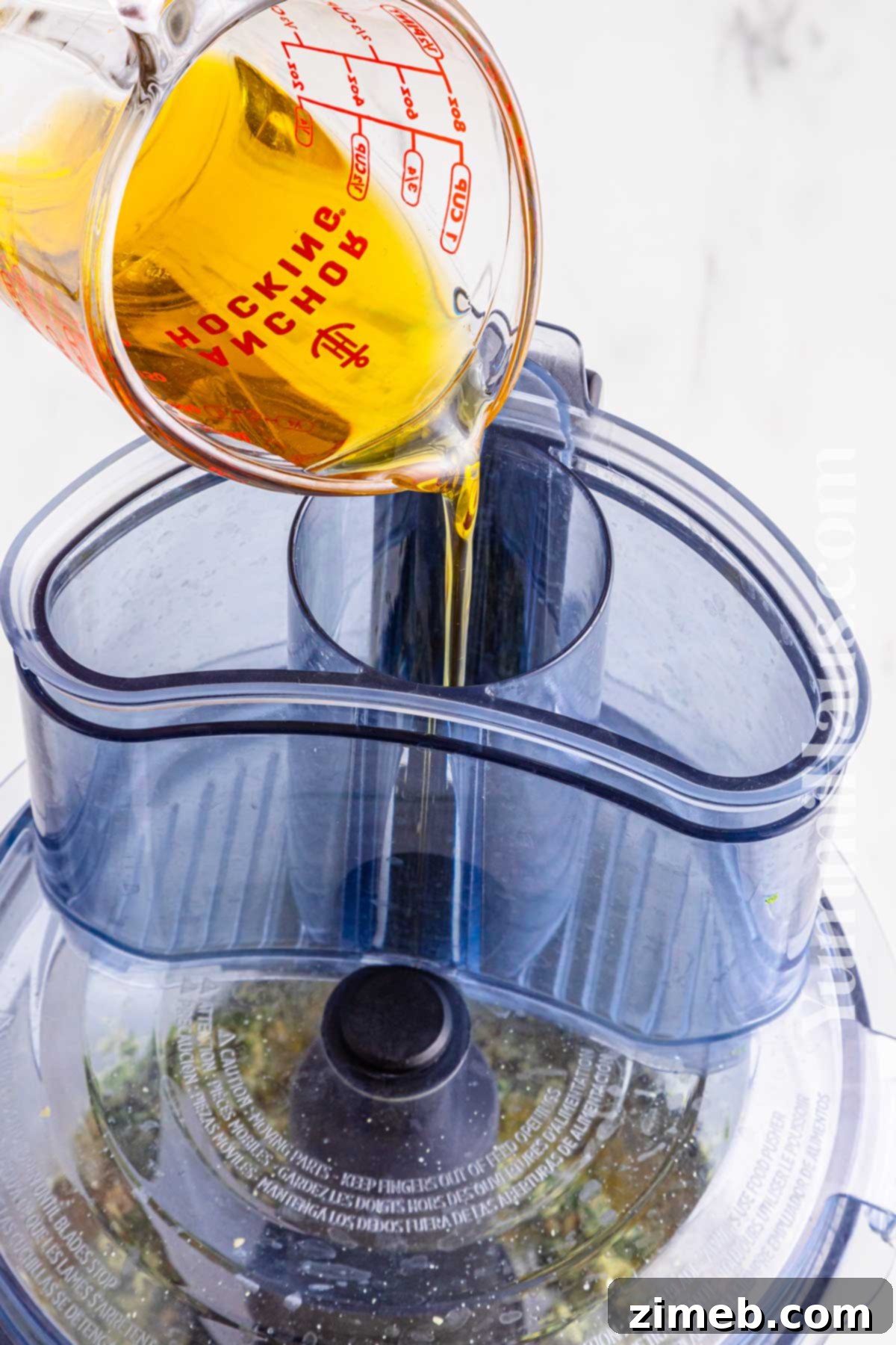 The Ultimate Homemade Pesto for Pasta 7 adding the oil