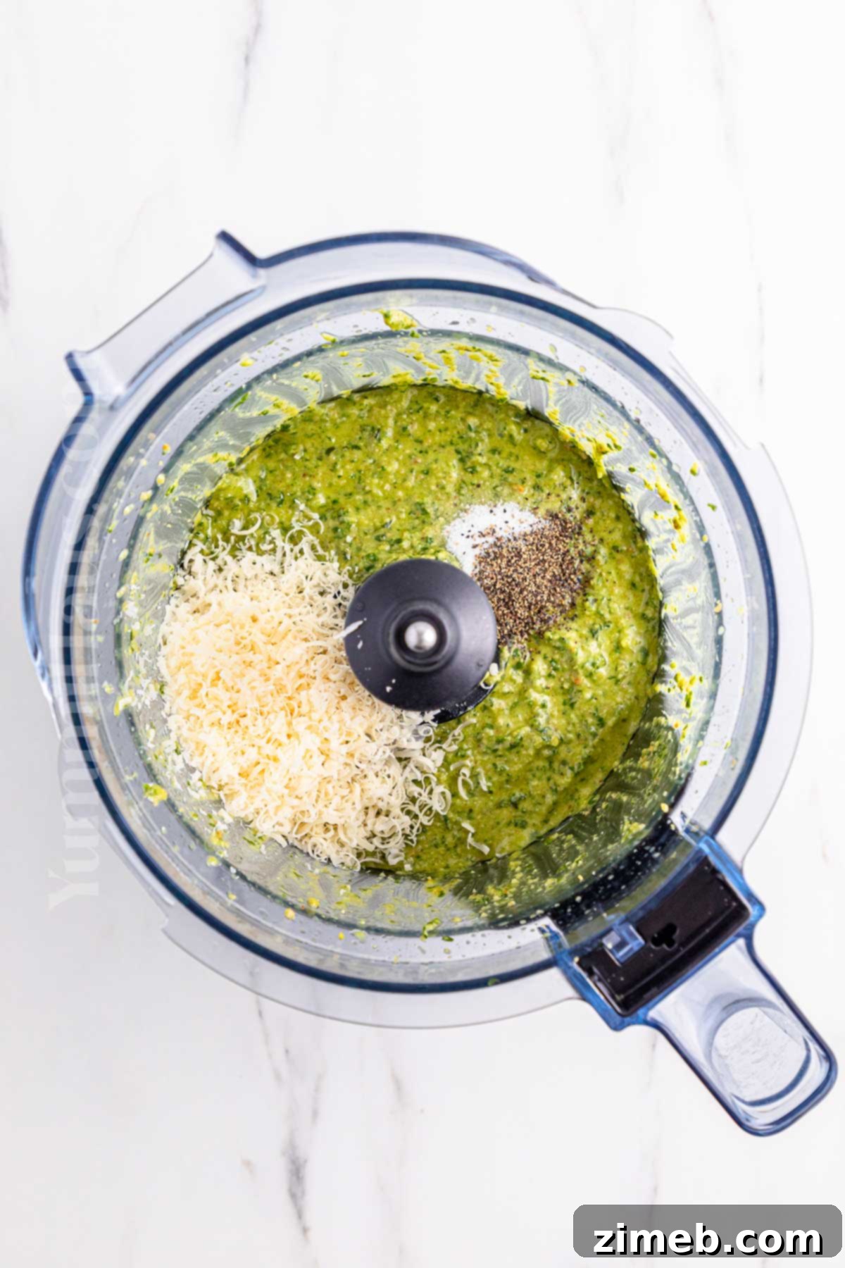 The Ultimate Homemade Pesto for Pasta 8 blending the ingredients