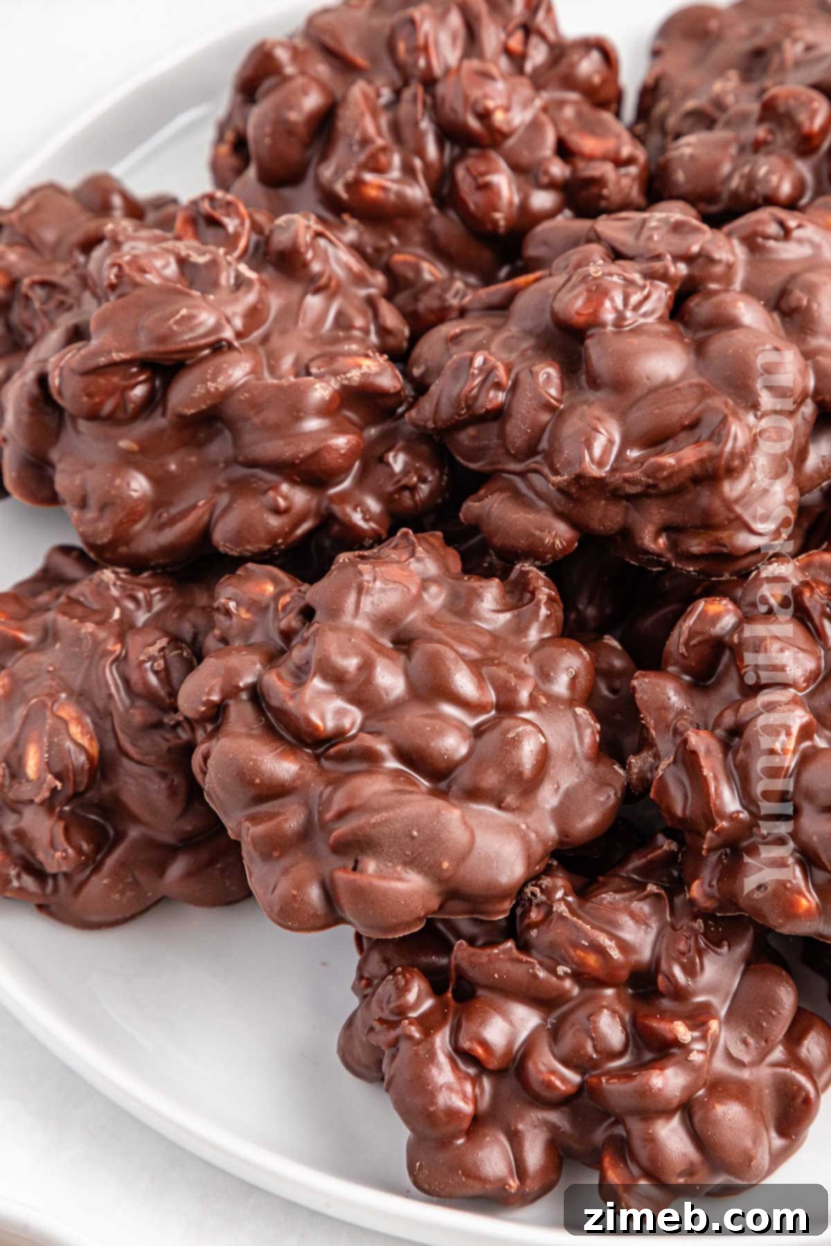 Slow Cooker Candy clusters with sprinkles on a festive background.