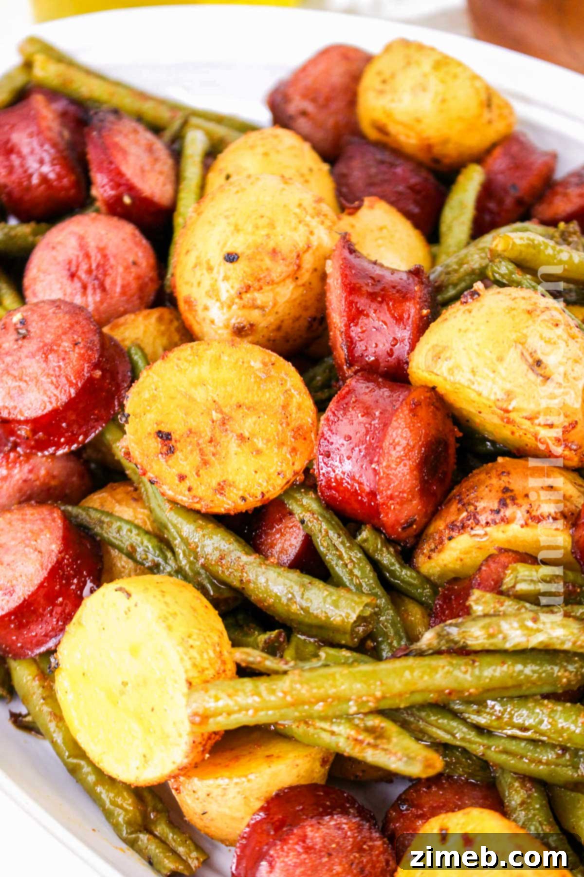 55 Irresistible Sides to Elevate Your Summer BBQ 41 Sausage, Green Beans, and Potatoes
