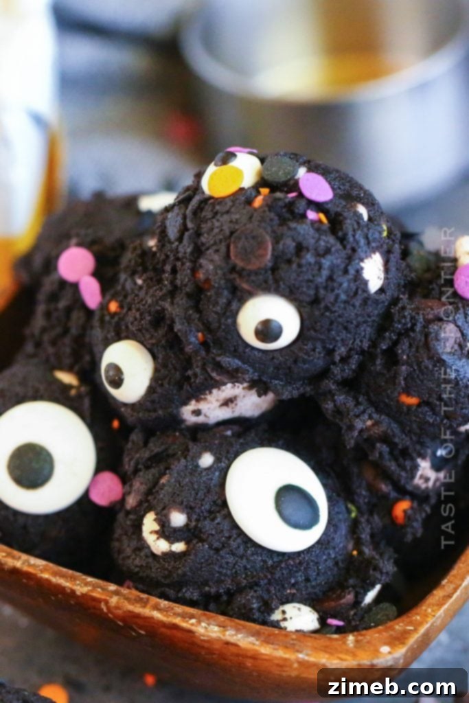 11 Ghoulish Halloween Cookie and Dough Creations 5 Bowl of Halloween cookie dough with chocolate chips, sprinkles, and candy eyeballs.