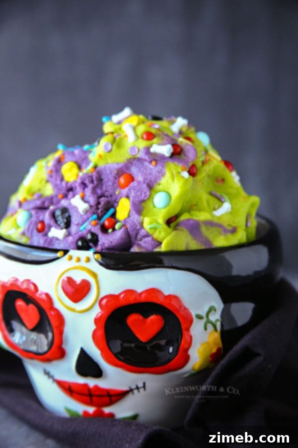 11 Ghoulish Halloween Cookie and Dough Creations 10 Vibrant green and purple egg-free sugar skull cookie dough with sprinkles.