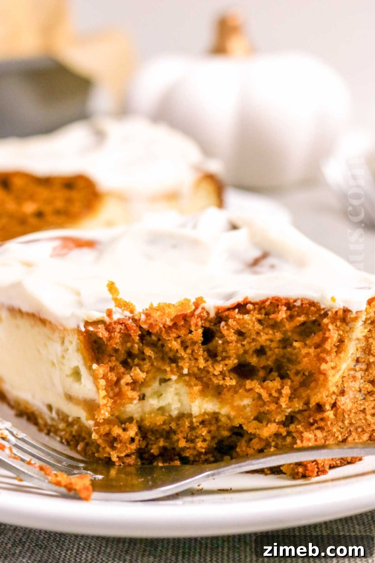 Decadent Pumpkin Cake Cheesecake, the ultimate fall dessert for Thanksgiving gatherings