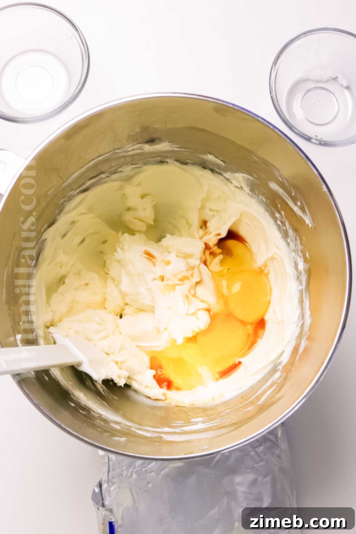 Making the creamy cheesecake layer for Pumpkin Cake Cheesecake