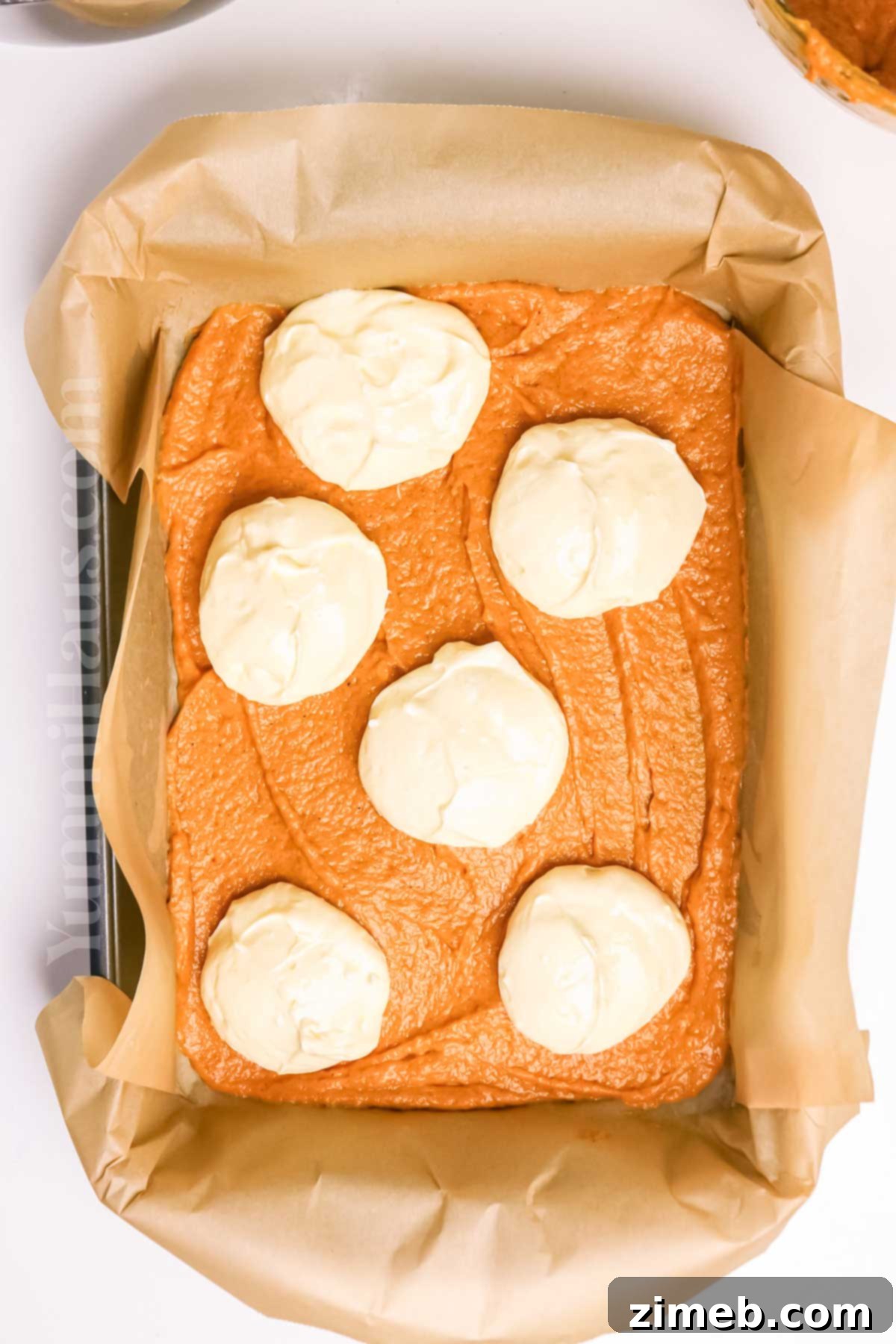Making the pumpkin cake with cheesecake filling