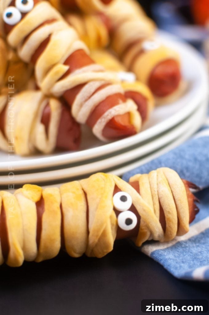 10 Ghoulish Halloween Party Treats 4 Mummy Dogs Recipe - Hot Dogs wrapped in crescent dough